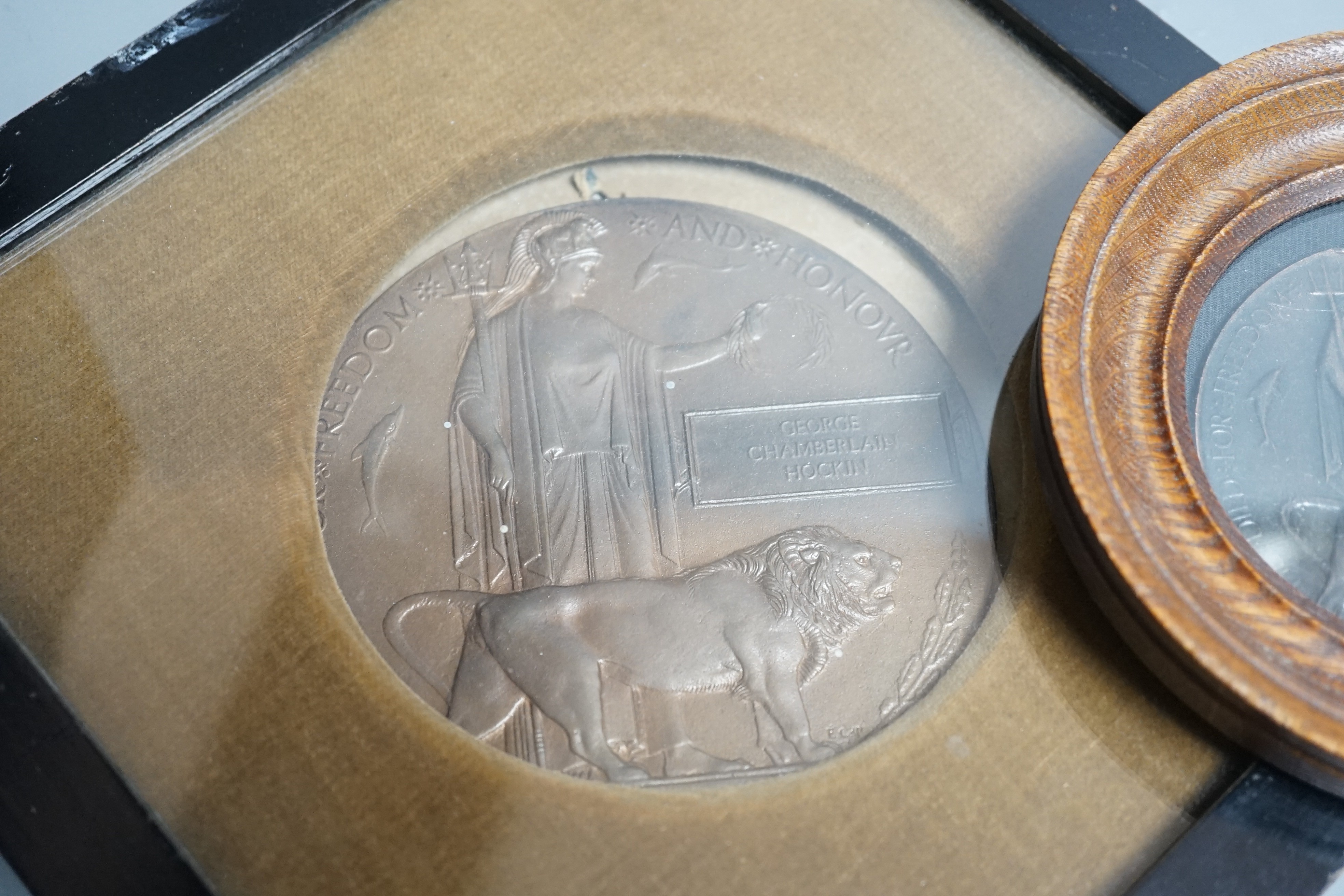 A framed WWI bronze death plaque to George Chamberlain Hockin, Lieutenant George Chamberlain Hockin of 7th Gurkha Rifles, aged 23 years killed in action at Ctesiphon, Mesopotamia, Nov. 23rd 1915, 11 cms diameter, and a r